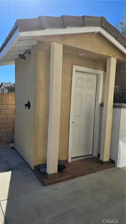 a view of a front door and bedroom