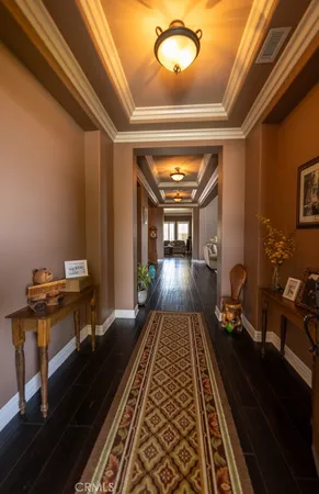 a sitting area with wooden floor