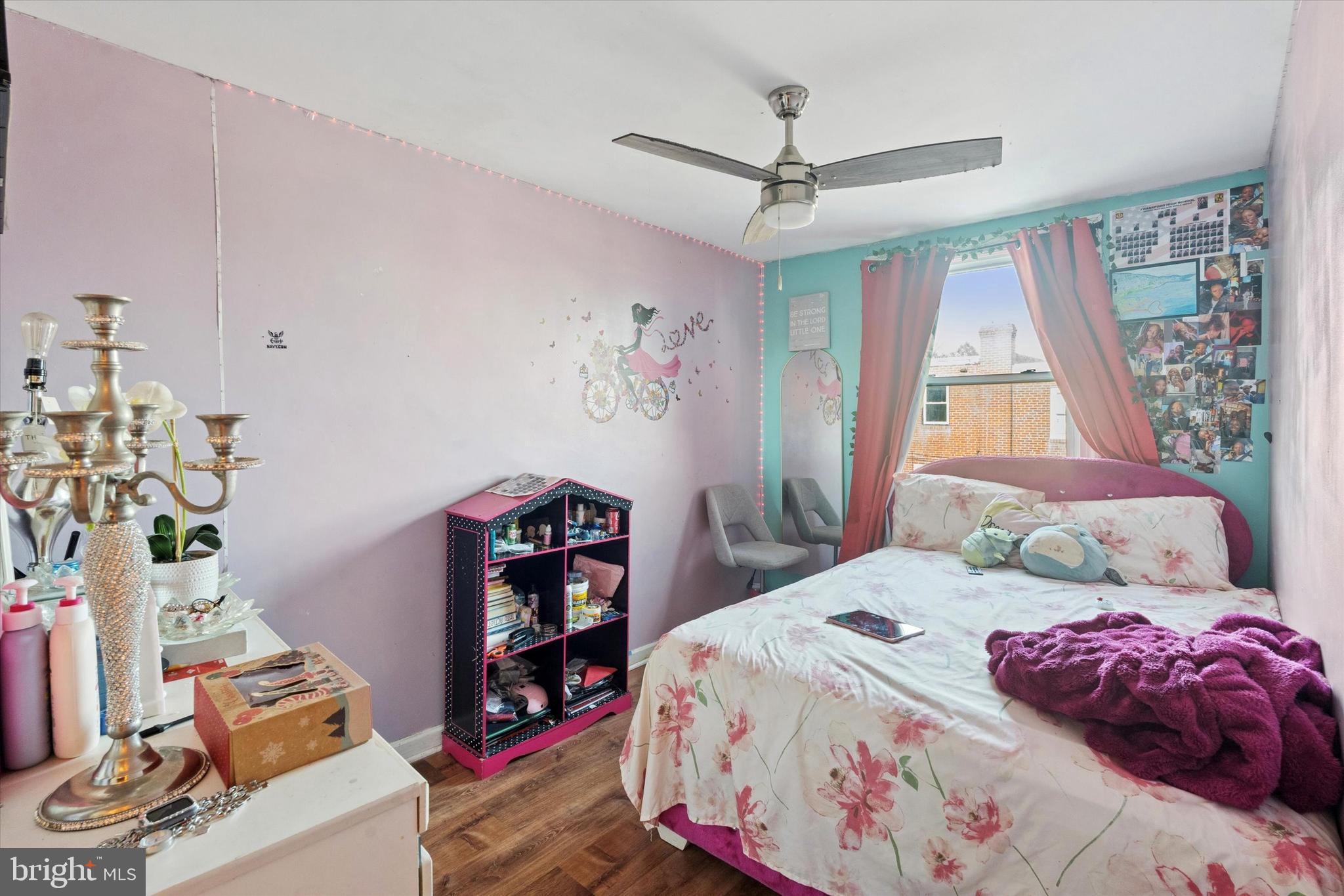 213 East Claremont Road Philadelphia, PA 19120 - Photo 11 of 25 a bedroom with a bed and a window