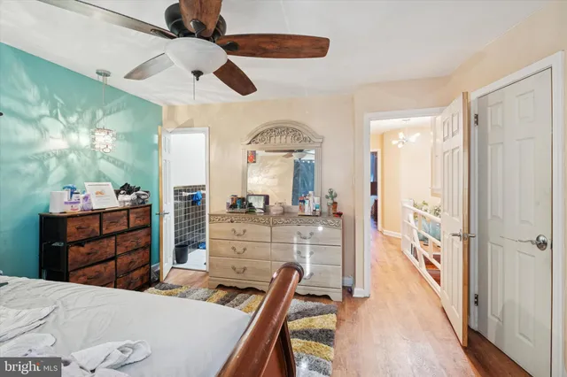 a room with a bed and a dresser