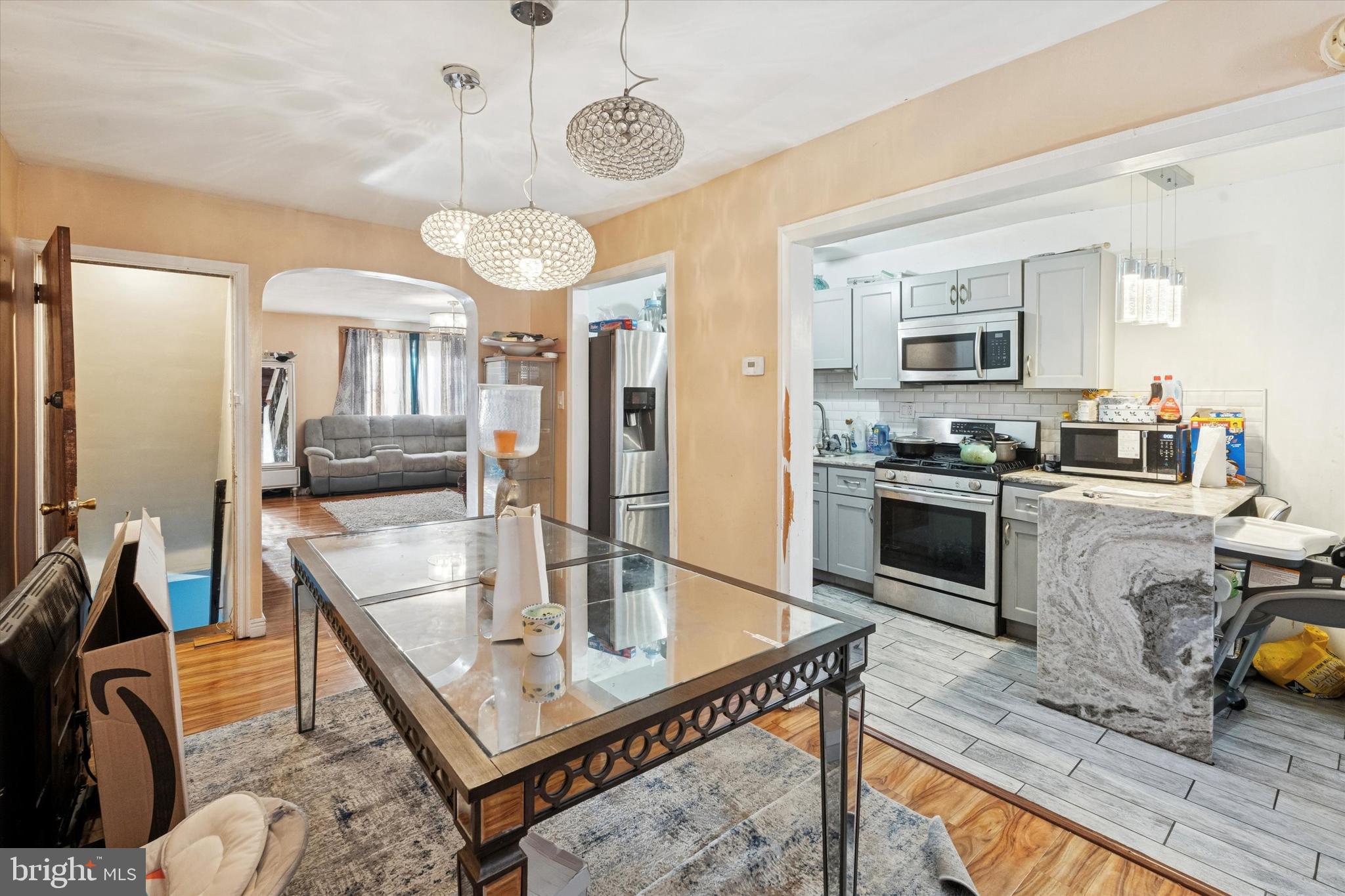 213 East Claremont Road Philadelphia, PA 19120 - Photo 6 of 25 a living room with fireplace furniture and a flat screen tv