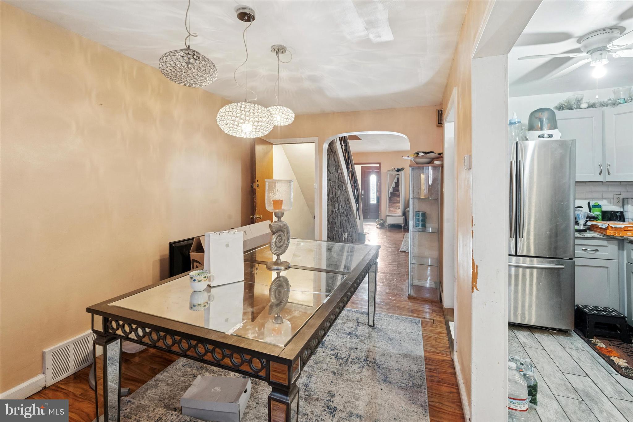 213 East Claremont Road Philadelphia, PA 19120 - Photo 7 of 25 a view of a kitchen area with furniture and wooden floor