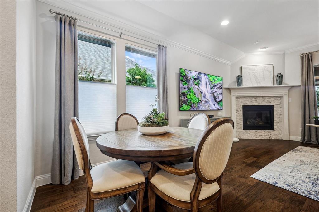 1601 Twistleaf Road Flower Mound, TX 76226 - Photo 17 of 39 a view of a dining room with furniture window and wooden floor