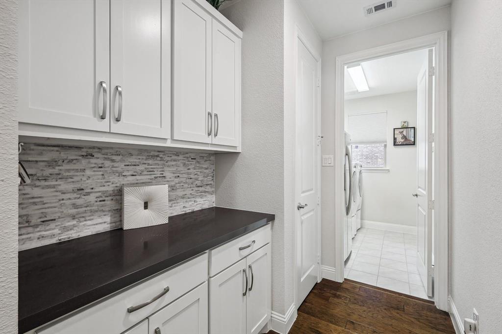1601 Twistleaf Road Flower Mound, TX 76226 - Photo 18 of 39 a kitchen with white cabinets and sink