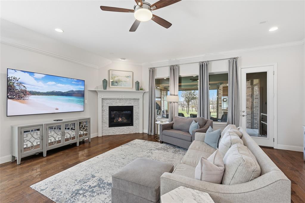 1601 Twistleaf Road Flower Mound, TX 76226 - Photo 23 of 39 a living room with furniture and a fireplace
