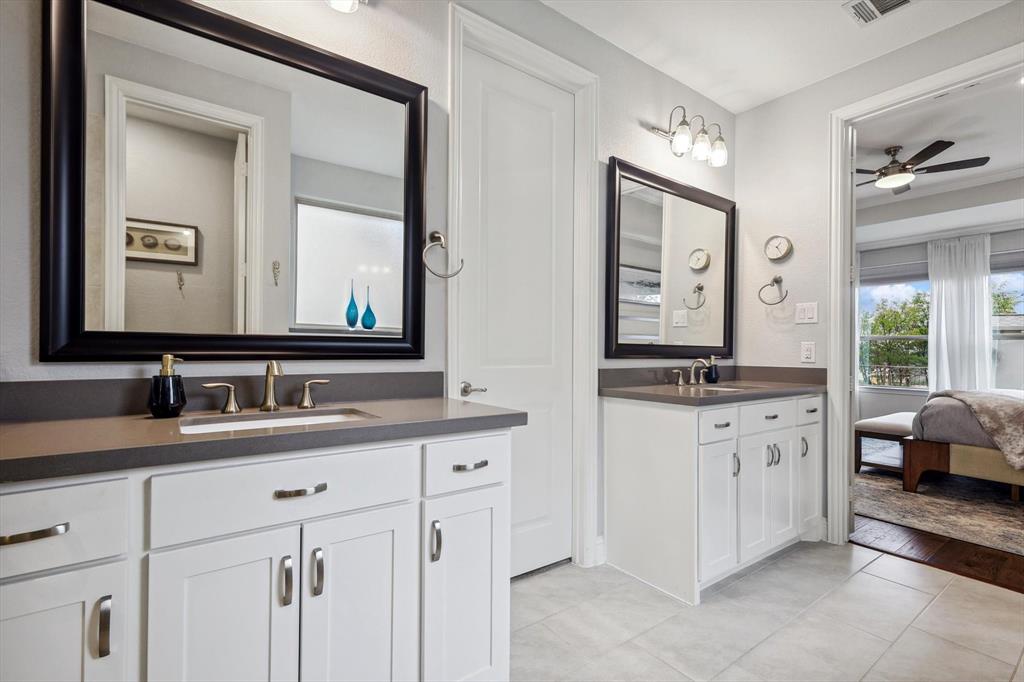 1601 Twistleaf Road Flower Mound, TX 76226 - Photo 28 of 39 a en suite bathroom with a double vanity sink a mirror and a window