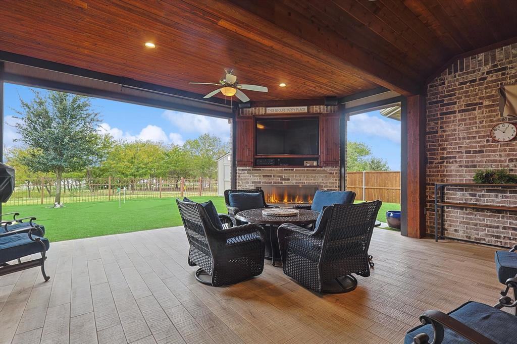 1601 Twistleaf Road Flower Mound, TX 76226 - Photo 3 of 39 a living room with patio fireplace furniture and a garden