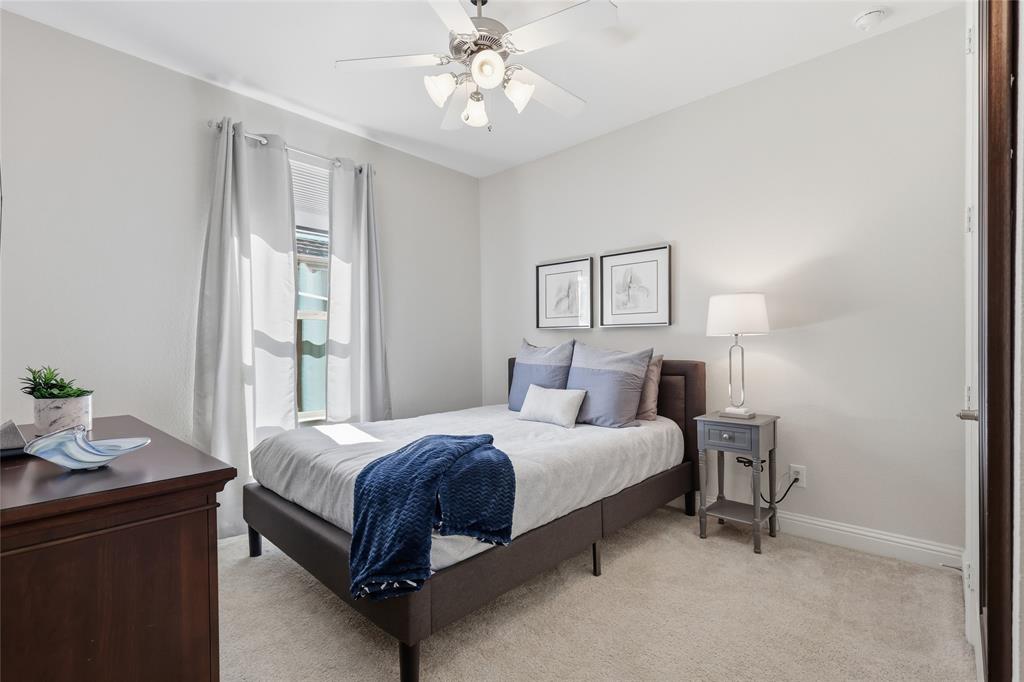 1601 Twistleaf Road Flower Mound, TX 76226 - Photo 32 of 39 a bedroom with a bed and a table