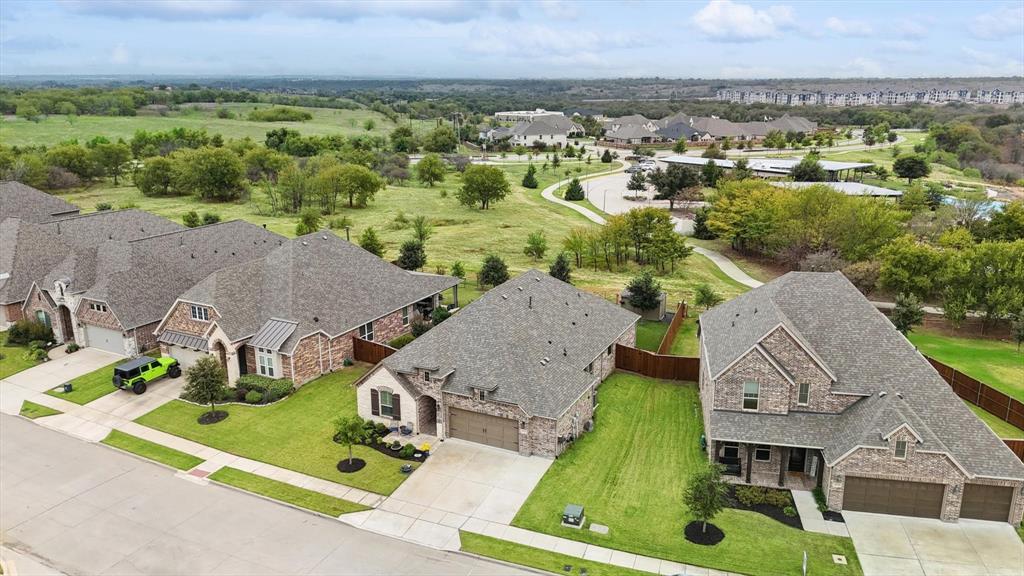 1601 Twistleaf Road Flower Mound, TX 76226 - Photo 34 of 39 an aerial view of residential houses with outdoor space and parking