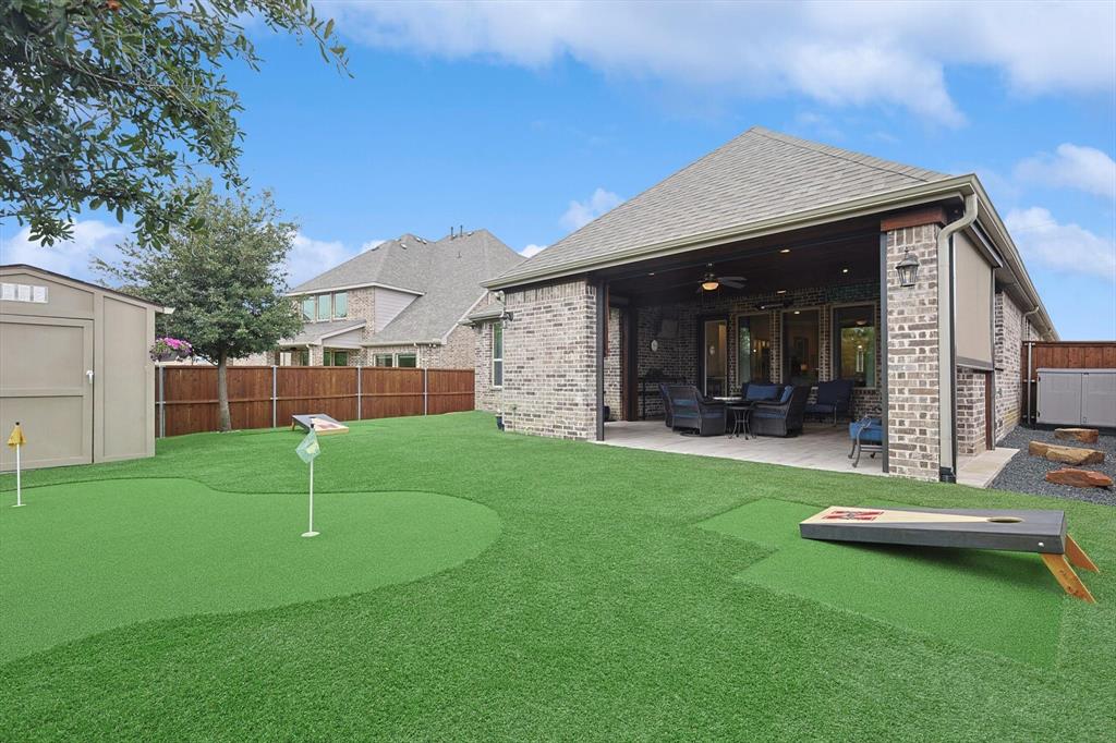 1601 Twistleaf Road Flower Mound, TX 76226 - Photo 7 of 39 a view of a backyard with a slide
