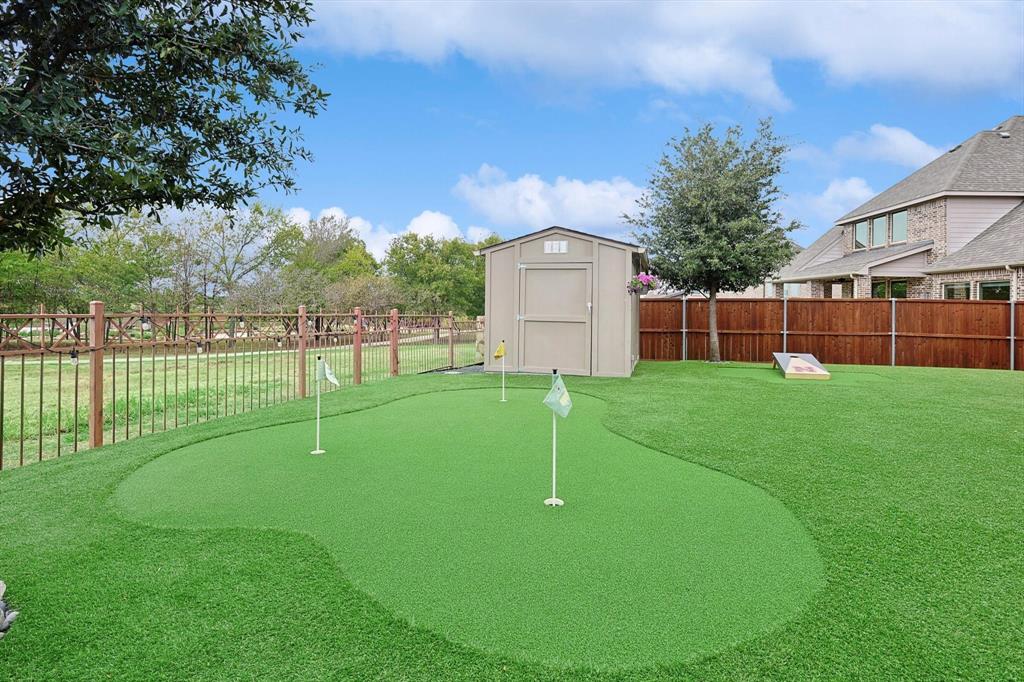 1601 Twistleaf Road Flower Mound, TX 76226 - Photo 8 of 39 a view of a house with a backyard