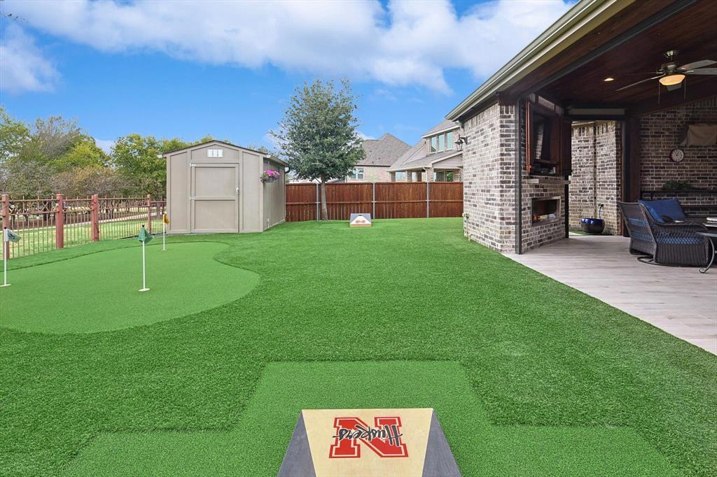 1601 Twistleaf Road Flower Mound, TX 76226 - Photo 9 of 39 a view of a backyard with a garden and entertaining space