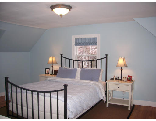 31 Franklin Road Winchester, MA 01890 - Photo 8 of 10 a bedroom with a bed and lamp on table
