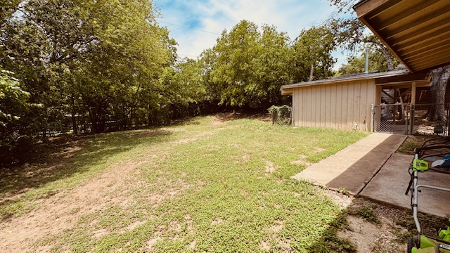 4614 Raintree Boulevard Austin, TX 78745 - Photo 12 of 14 a backyard of a house with table and chairs