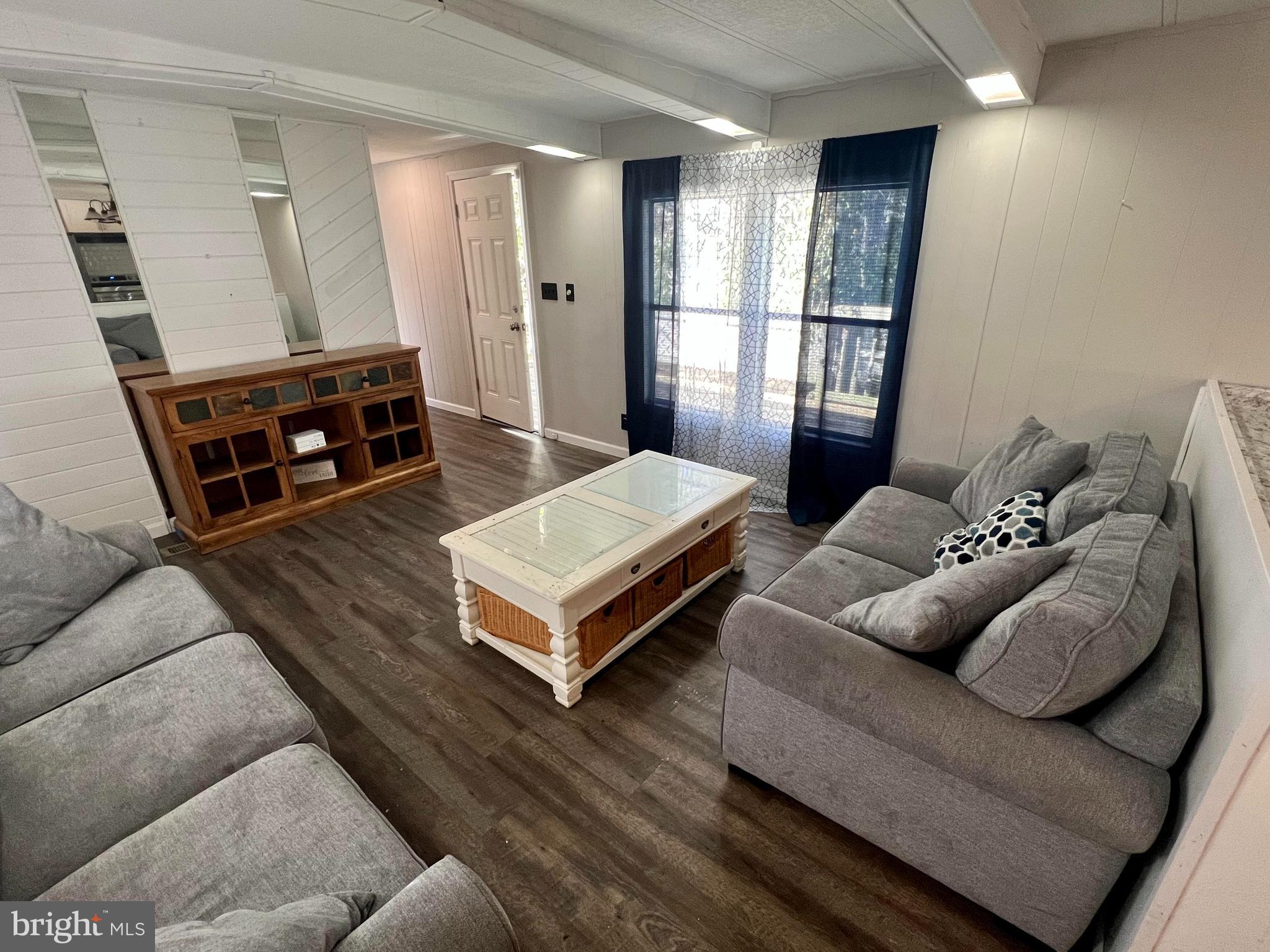 31679 Maple Lewes, DE 19958 - Photo 7 of 11 LR w/ new LVP (couches included - new in May 2023)