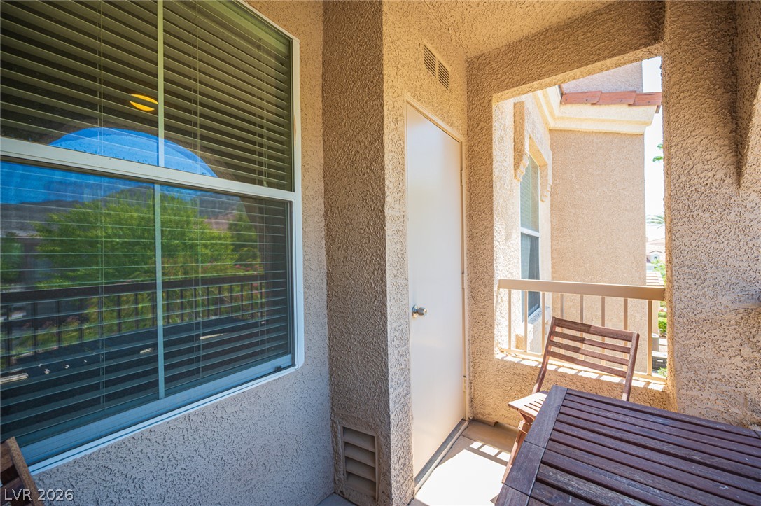 10550 West Alexander Road, Unit 2014 Las Vegas, NV 89129 - Photo 10 of 35 Step out to a private balcony, an ideal spot for morning coffee or evening relaxation.