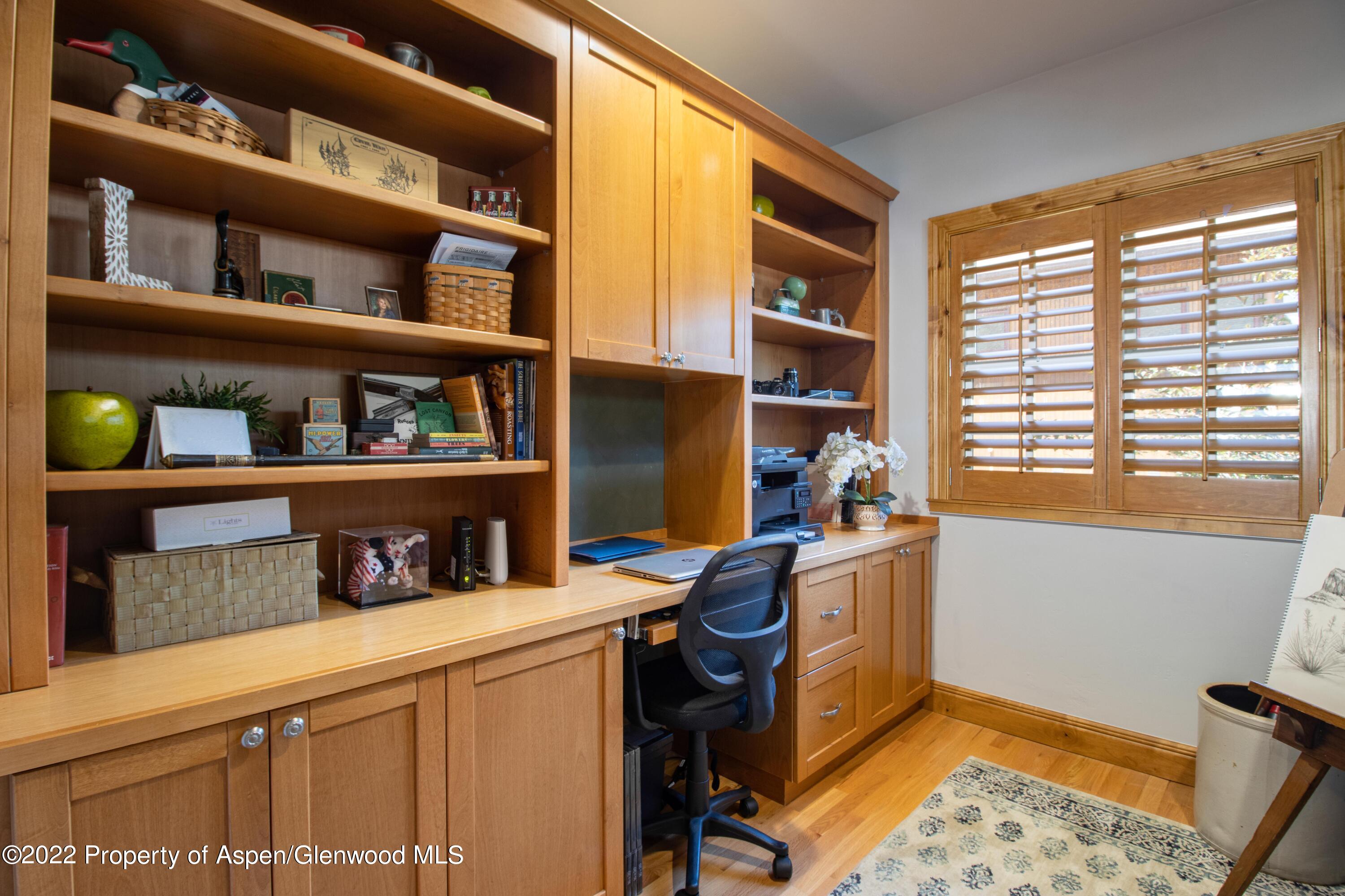 323 Faas Ranch Road New Castle, CO 81647 - Photo 12 of 22 a work place with a large window and book shelf