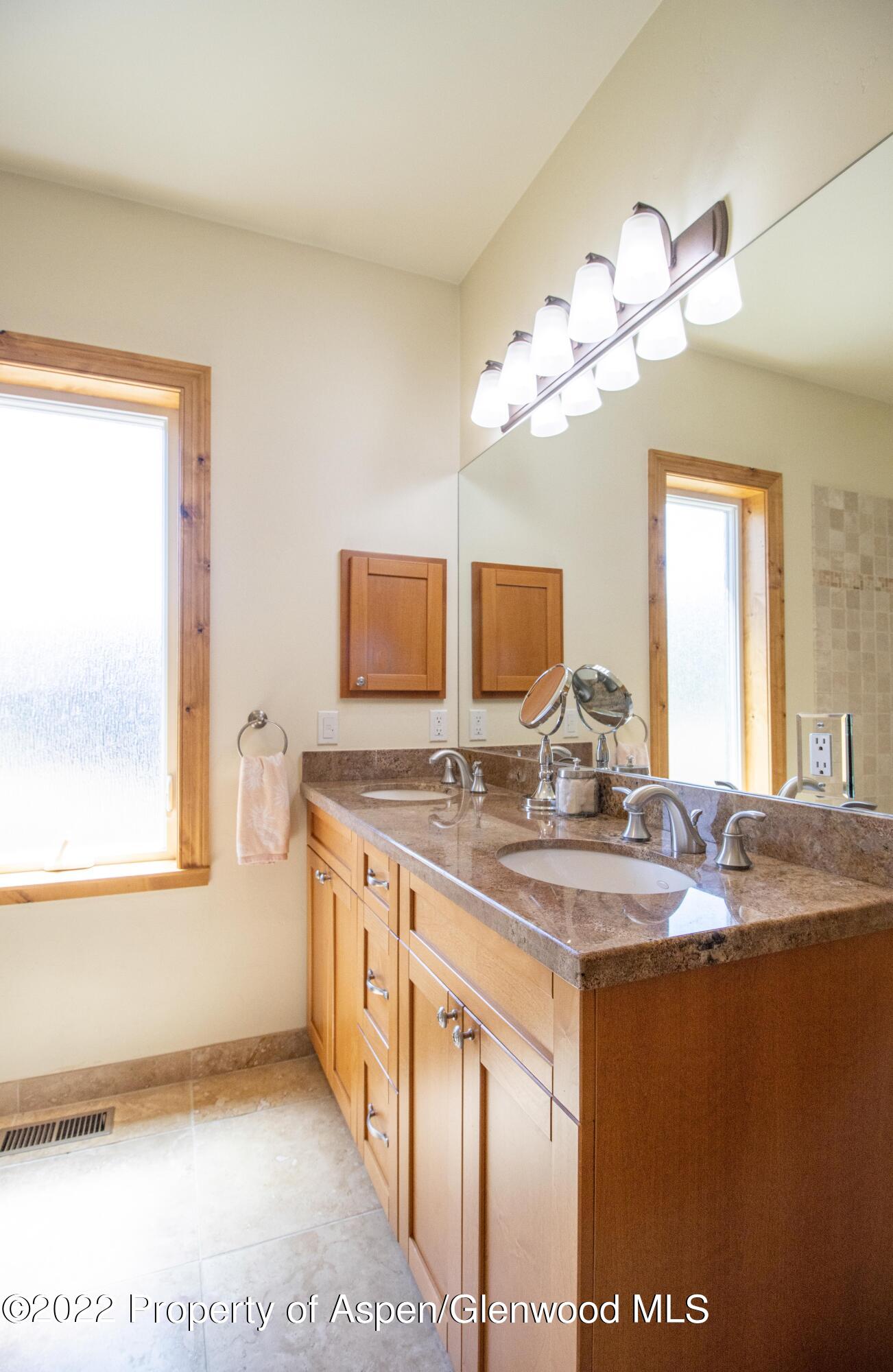 323 Faas Ranch Road New Castle, CO 81647 - Photo 15 of 22 a bathroom with a sink a vanity and a mirror