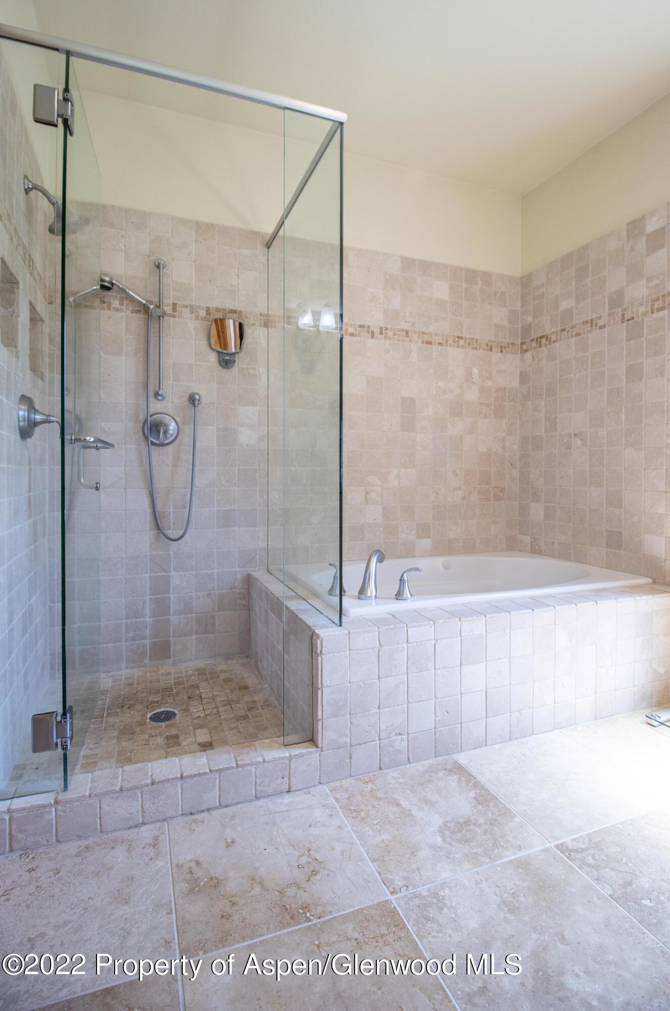 323 Faas Ranch Road New Castle, CO 81647 - Photo 16 of 22 a bathroom with a glass shower door