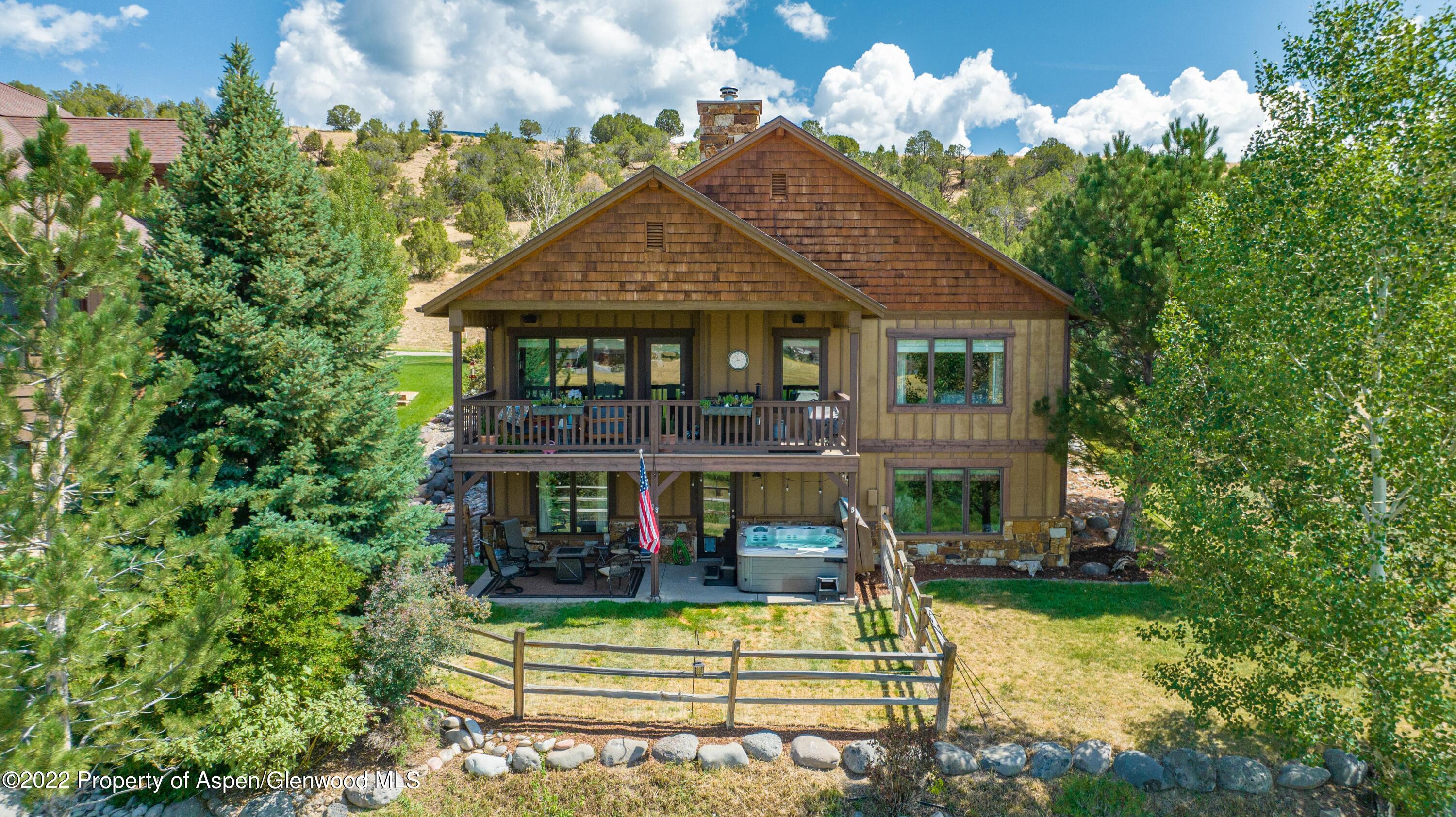 323 Faas Ranch Road New Castle, CO 81647 - Photo 2 of 22 a front view of a house with a yard