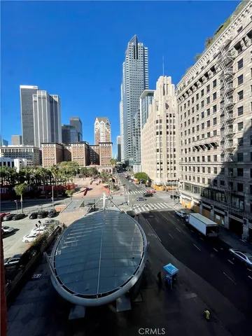 a view of swimming pool outdoor outdoor seating and city view