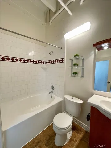 a bathroom with a sink a toilet and a bathtub