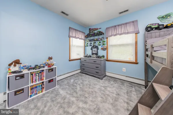 a room with furniture a bed and a window