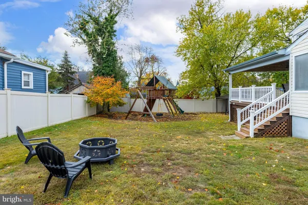 a view of a backyard with table and chairs