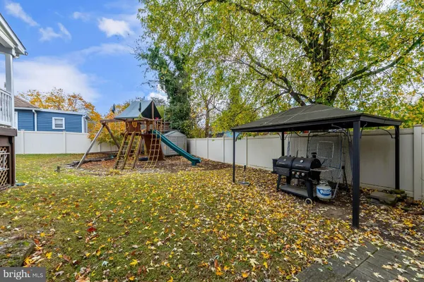 an outdoor space with furniture and umbrella