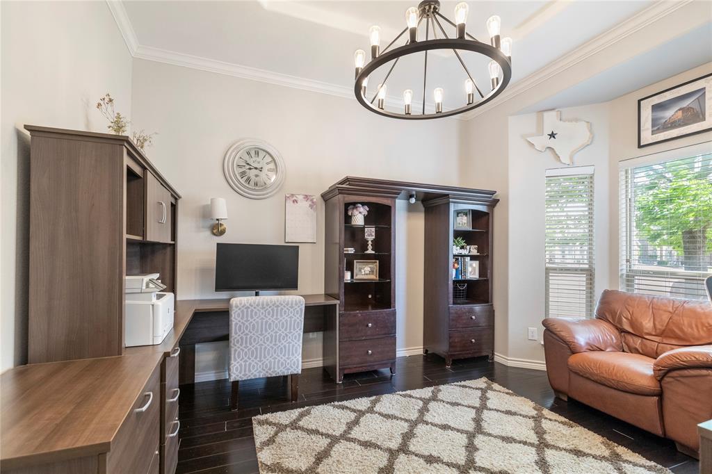 11604 Compton Trail Fort Worth, TX 76244 - Photo 17 of 40 a living room with stainless steel appliances furniture a rug and a chandelier