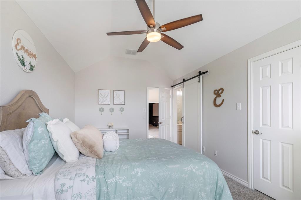 11604 Compton Trail Fort Worth, TX 76244 - Photo 19 of 40 a bedroom with a bed and a ceiling fan