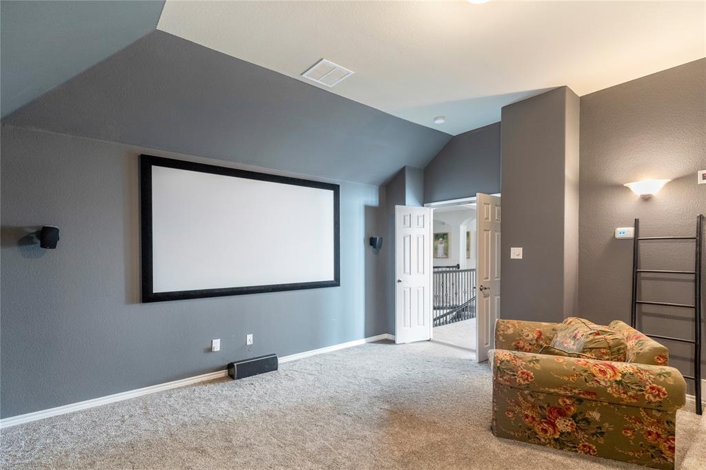 11604 Compton Trail Fort Worth, TX 76244 - Photo 29 of 40 a living room with furniture and a flat screen tv