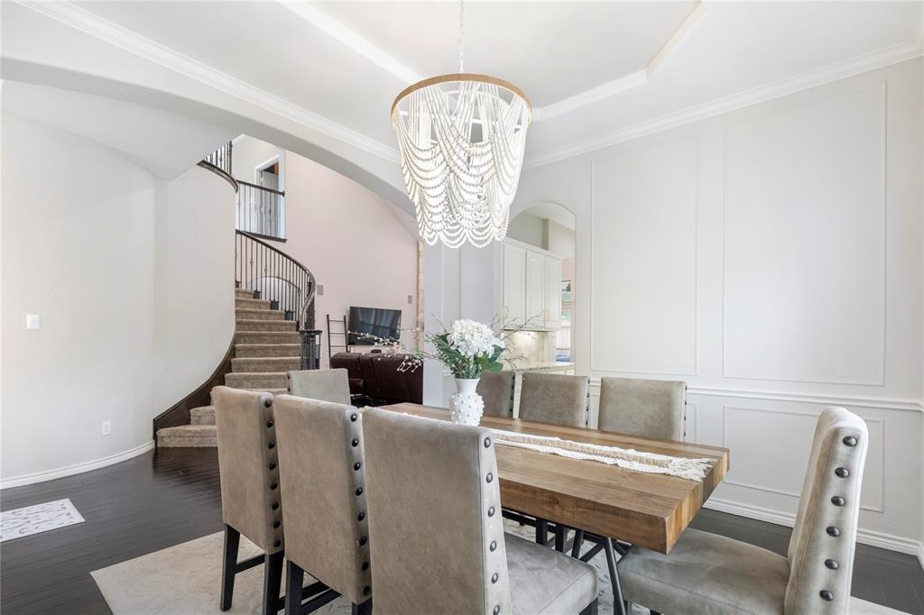 11604 Compton Trail Fort Worth, TX 76244 - Photo 6 of 40 a view of a dining room with furniture and a chandelier