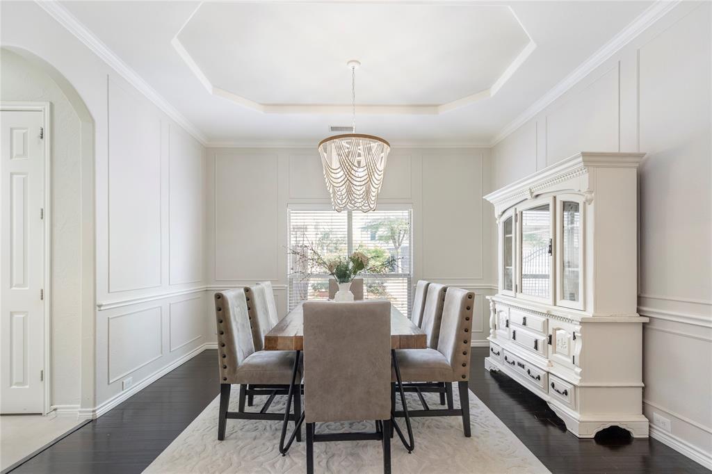 11604 Compton Trail Fort Worth, TX 76244 - Photo 7 of 40 a dining room with furniture a chandelier and wooden floor
