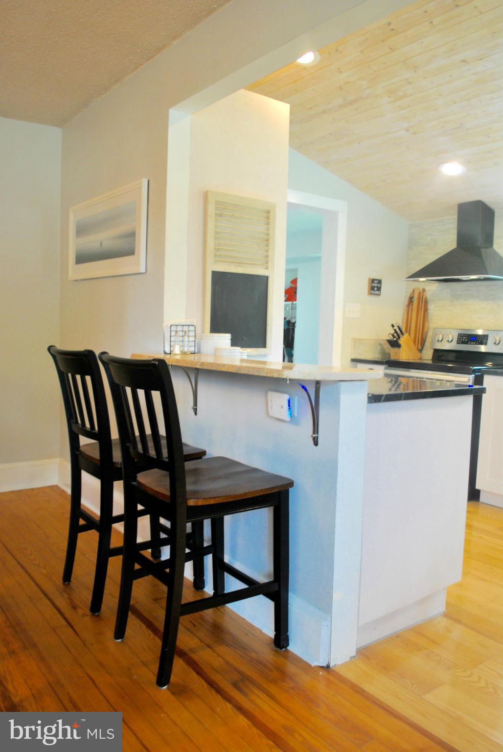 6359 Thamert Road Neavitt, MD 21652 - Photo 12 of 30 Breakfast bar with live wood bar top.