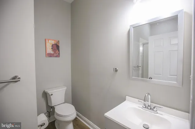 a bathroom with a bathtub shower sink and toilet