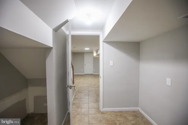 a view of an empty room with stairs