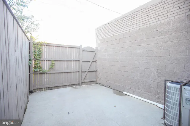 a picture of a bench in front of a window
