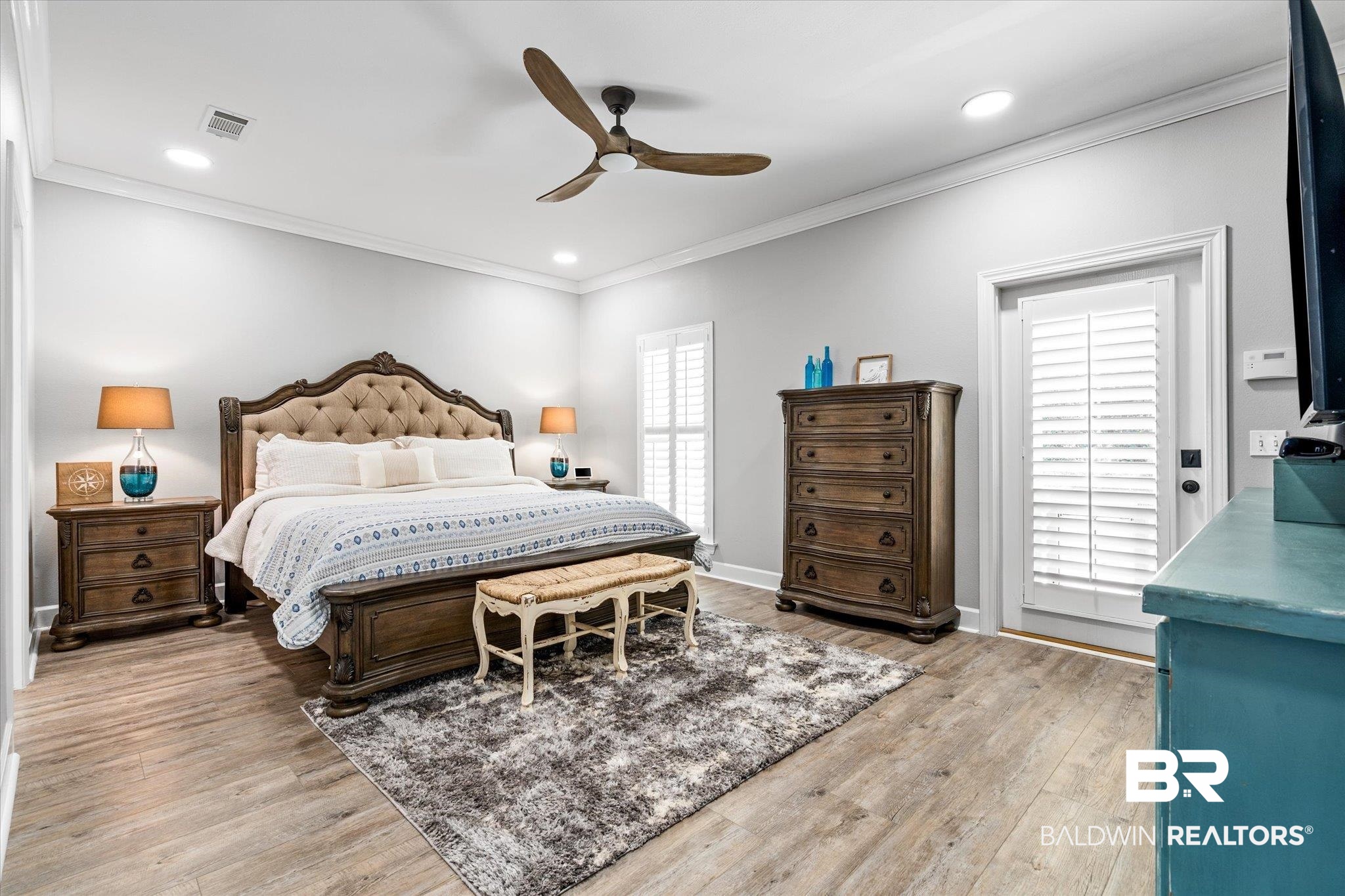 4947 Look Rook Road Orange Beach, AL 36561 - Photo 11 of 24 Bedroom with light wood-style flooring, ornamental molding, visible vents, and recessed lighting