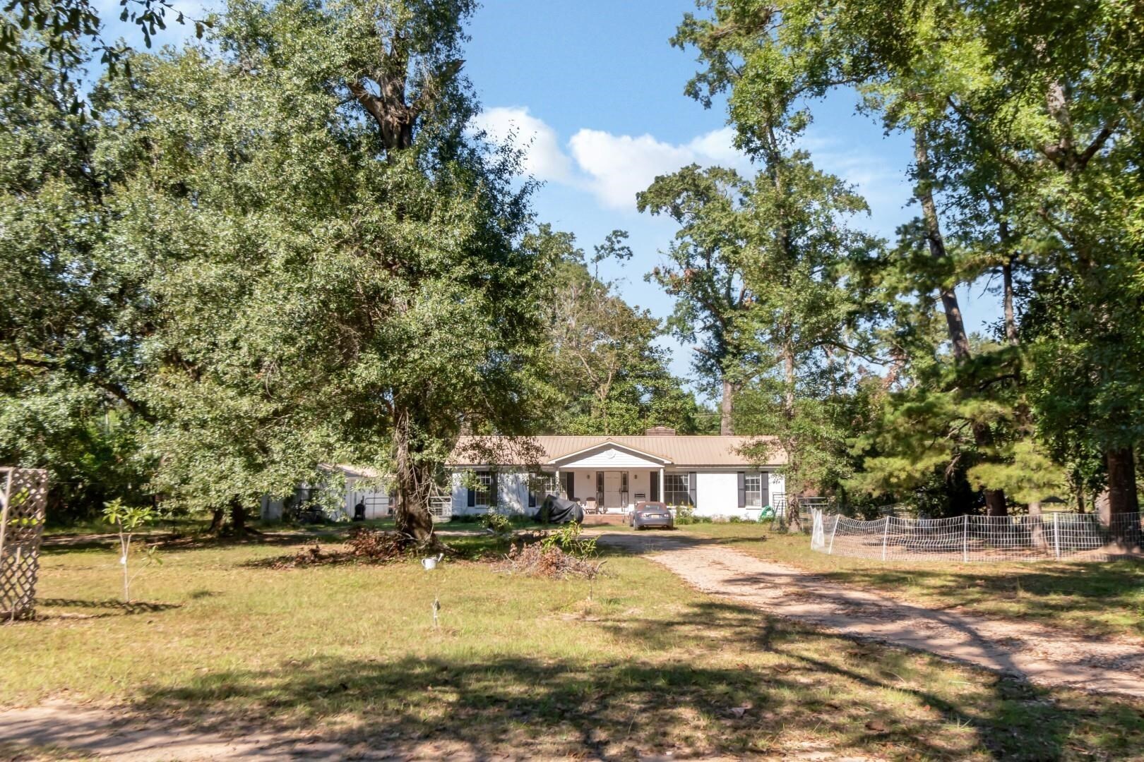6405 1st Street Wilmer, AL 36587 - Photo 37 of 38 Ranch-style house with view of wooded area and driveway