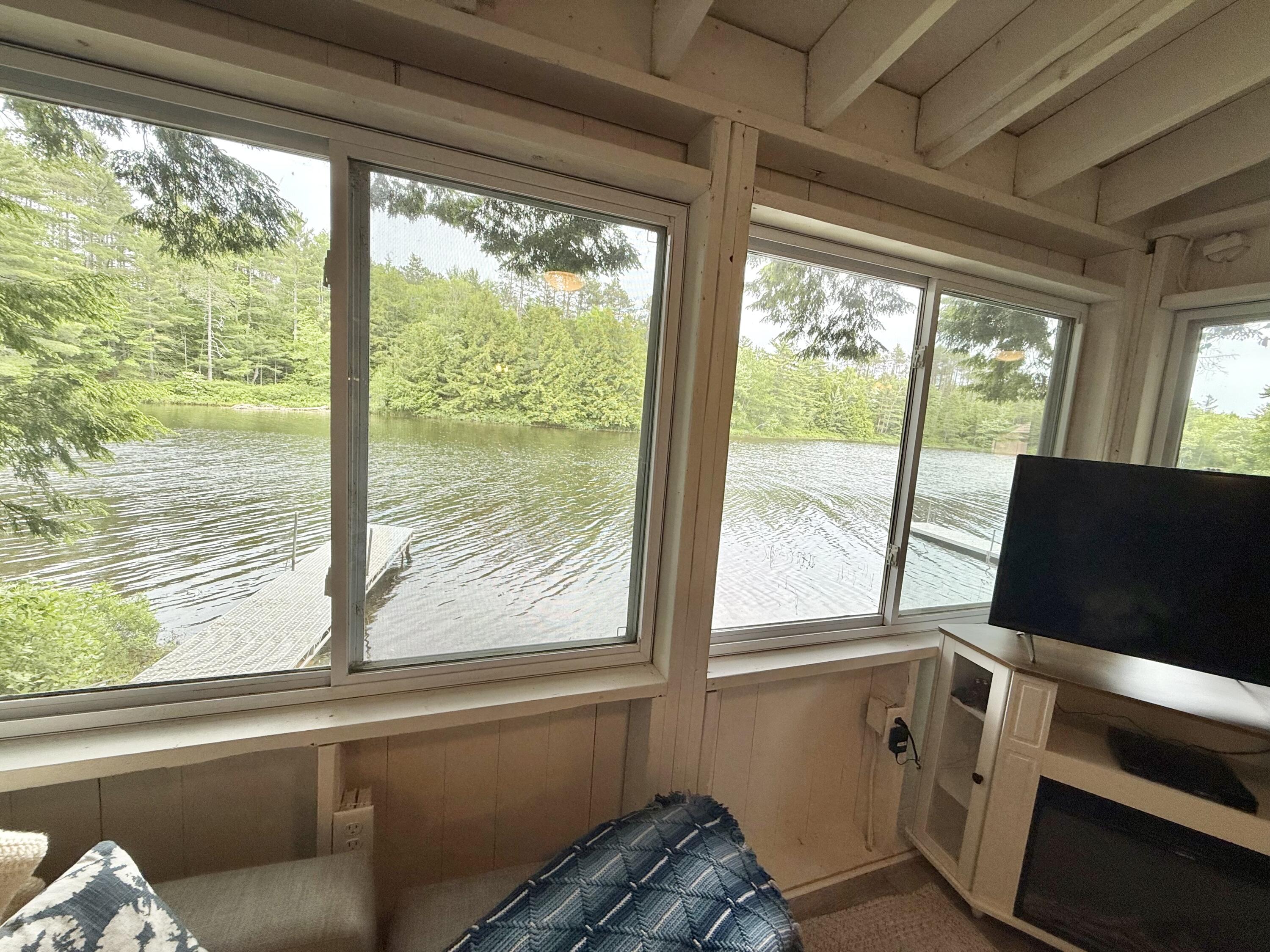 628 Springy Pond Road Otis, ME 04605 - Photo 12 of 25 Living room view of pond