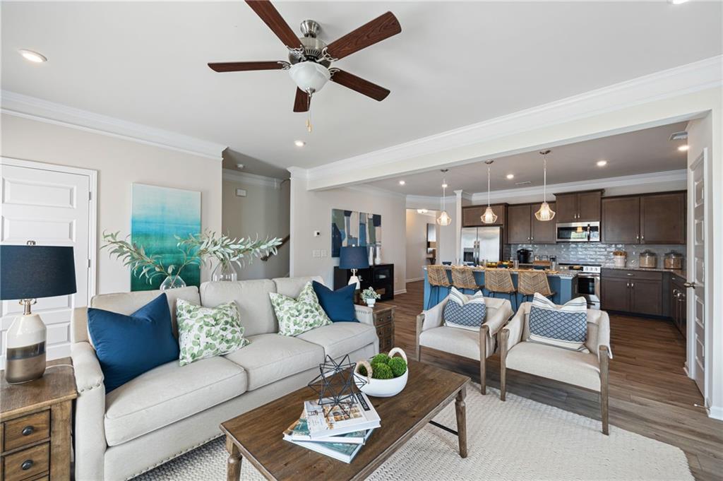 70 Pinnacle Way Jasper, GA 30143 - Photo 11 of 20 a view of a living room or kitchen and a dining table with wooden floor