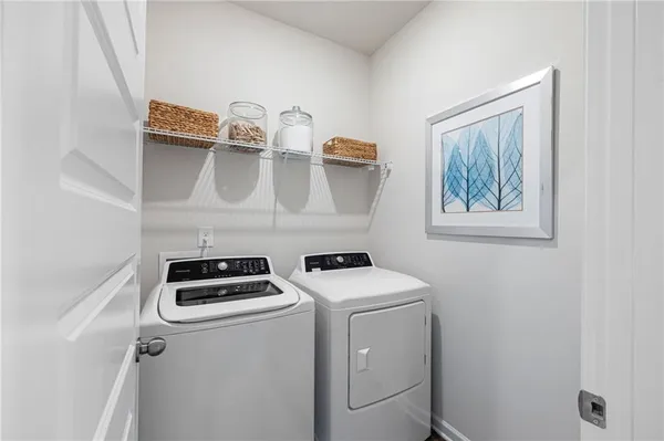 a utility room with dryer and washer
