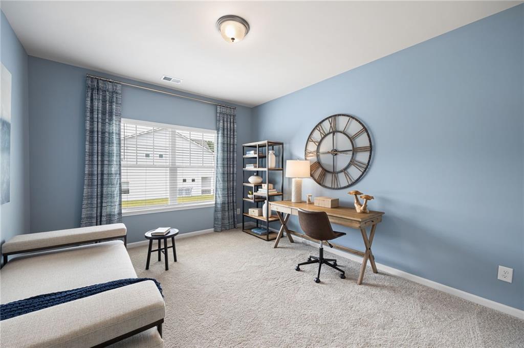 70 Pinnacle Way Jasper, GA 30143 - Photo 19 of 20 a living room with furniture a clock and a large window