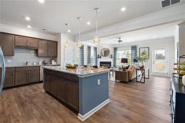 a large kitchen with stainless steel appliances lots of counter top space