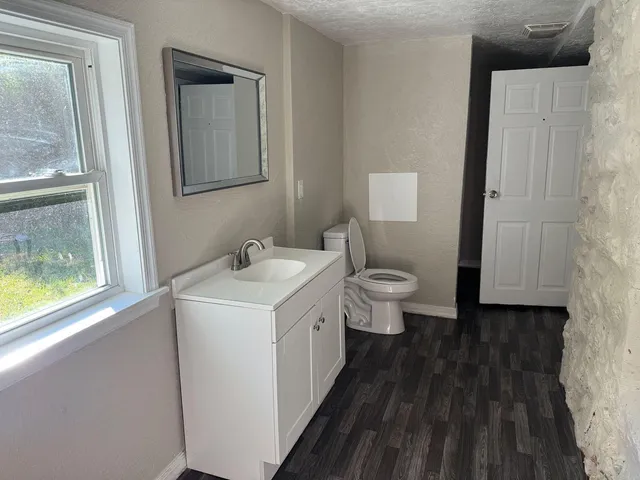 a bathroom with a sink and a toilet