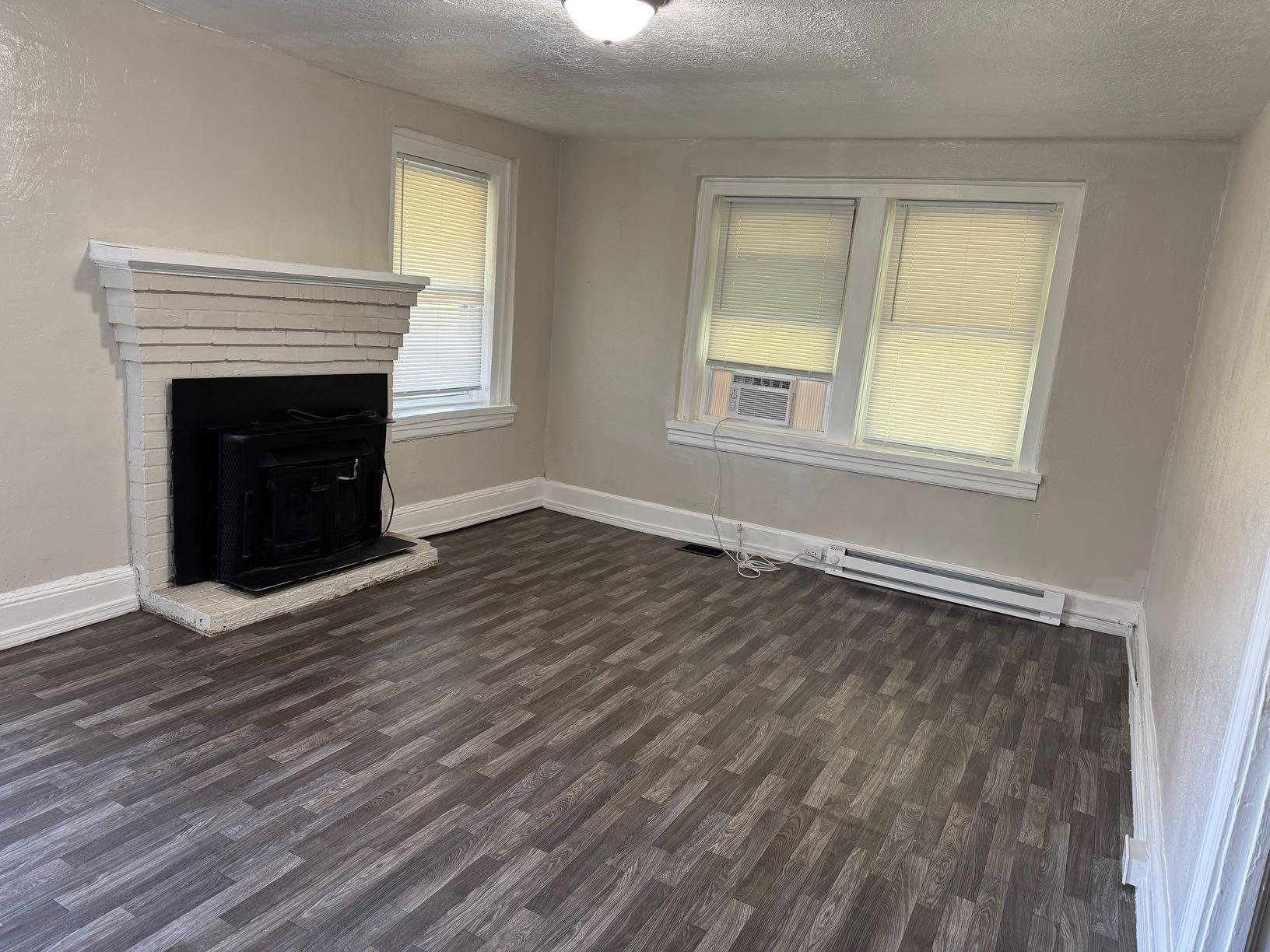 965 Hodges Farm Road Martinsville, VA 24112 - Photo 6 of 12 a view of an empty room with wooden floor and a window