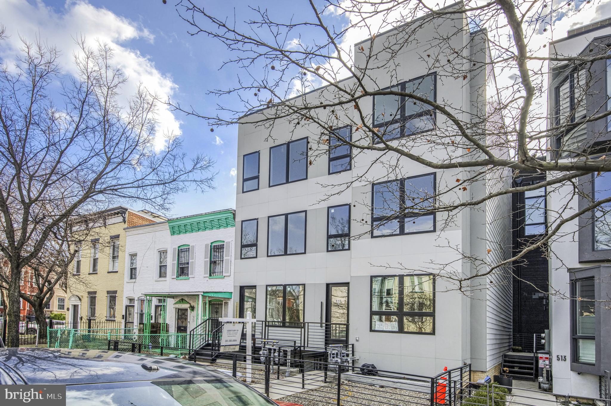 a view of a brick building next to a road