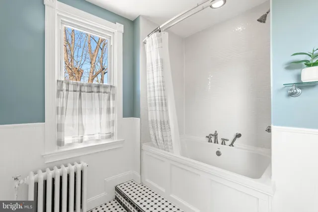 a bed room with a bed and a chair