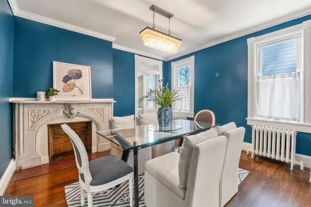 a dining room with furniture and wooden floor